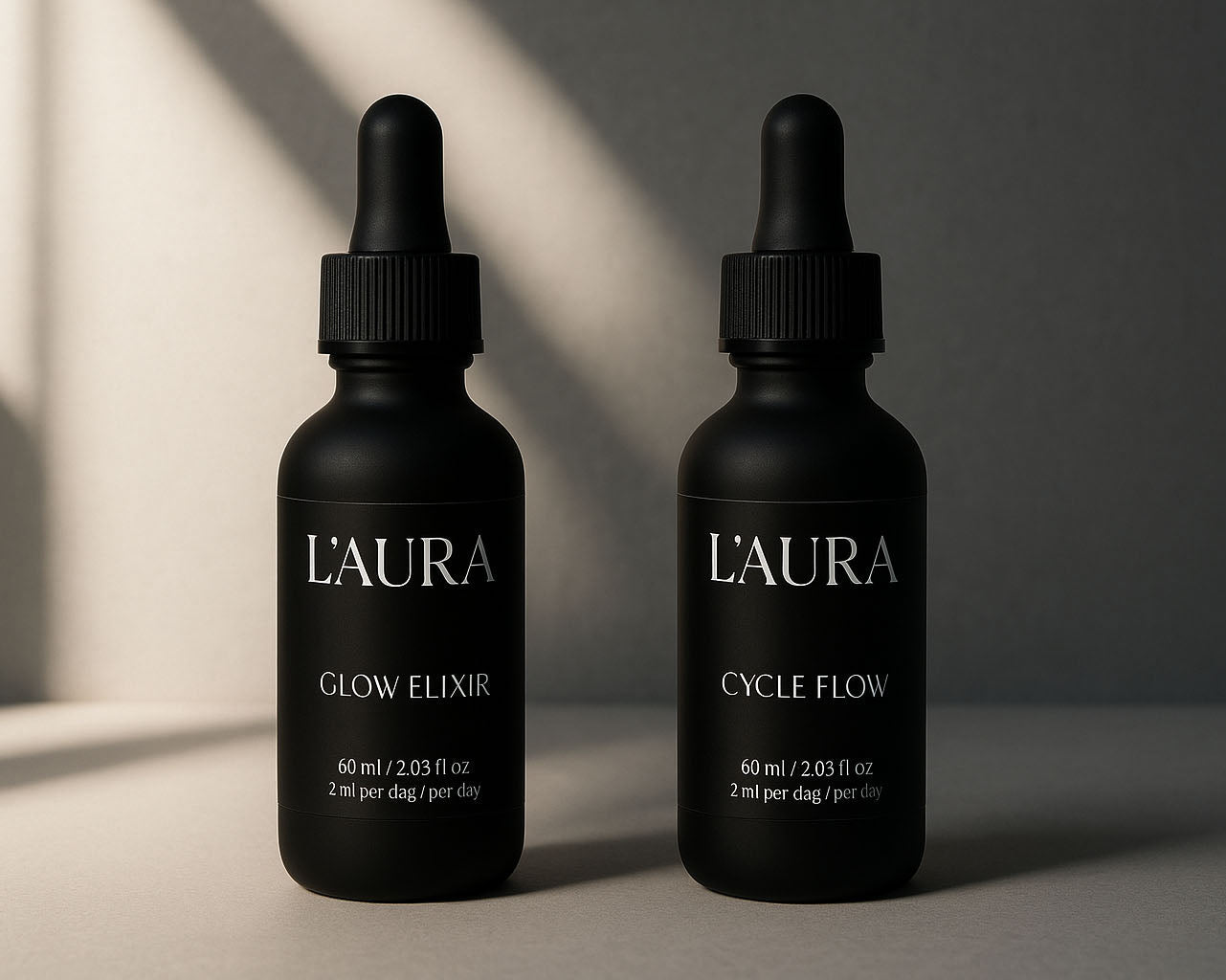 2 L'AURA bottles in soft light Product Page